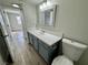 Bathroom features modern vanity with grey cabinets and white countertop at 2964 Juniper Hills Blvd # 202, Las Vegas, NV 89142