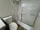 Bathroom features white toilet and bathtub with shower enclosure at 2964 Juniper Hills Blvd # 202, Las Vegas, NV 89142
