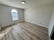 Bright bedroom with wood floors and arched window at 2964 Juniper Hills Blvd # 202, Las Vegas, NV 89142