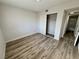 Bedroom showcasing wood-look flooring and closet with sliding doors at 2964 Juniper Hills Blvd # 202, Las Vegas, NV 89142