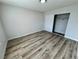 Spacious bedroom with wood floors and sliding closet doors at 2964 Juniper Hills Blvd # 202, Las Vegas, NV 89142