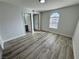 Light-filled bedroom featuring new flooring and large window at 2964 Juniper Hills Blvd # 202, Las Vegas, NV 89142