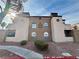 Exterior shot of building with lush landscaping, and well-maintained desert fauna at 2964 Juniper Hills Blvd # 202, Las Vegas, NV 89142