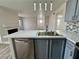 Kitchen featuring stainless steel dishwasher, sink and gray cabinets and modern countertops at 2964 Juniper Hills Blvd # 202, Las Vegas, NV 89142