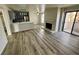 Spacious living room with fireplace, wood flooring, and a sliding door at 2964 Juniper Hills Blvd # 202, Las Vegas, NV 89142