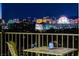 Balcony view showcasing the Las Vegas skyline at night with outdoor seating at 3111 Bel Air Dr # 12C, Las Vegas, NV 89109