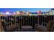 Balcony view showcasing the Las Vegas skyline at night with outdoor seating at 3111 Bel Air Dr # 12C, Las Vegas, NV 89109