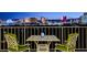 Relax on this inviting balcony with outdoor seating and bask in the dazzling cityscape views at sunset at 3111 Bel Air Dr # 12C, Las Vegas, NV 89109