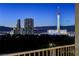 Enjoy stunning city views from this high-rise featuring iconic Las Vegas landmarks during the twilight hours at 3111 Bel Air Dr # 12C, Las Vegas, NV 89109