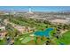 Aerial view of golf course with water feature and city skyline at 3111 Bel Air Dr # 12C, Las Vegas, NV 89109