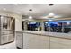 Modern kitchen with stainless steel appliances and granite countertops with Las Vegas Skyline at 3111 Bel Air Dr # 12C, Las Vegas, NV 89109