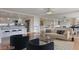 Open living room with kitchen, featuring modern furniture and bright natural light at 3111 Bel Air Dr # 12C, Las Vegas, NV 89109