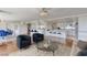 Open living room with kitchen, featuring modern furniture and bright natural light at 3111 Bel Air Dr # 12C, Las Vegas, NV 89109