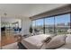 Bright main bedroom with a balcony, city views, and an open floor plan at 3111 Bel Air Dr # 12C, Las Vegas, NV 89109