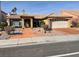 Charming single-story home featuring a tile roof, desert landscaping, and an attached two-car garage at 3625 N Campbell Rd, Las Vegas, NV 89129