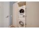 A stacked washer and dryer closet unit in white, space-saving laundry solution at 3722 Las Vegas Blvd # 1609, Las Vegas, NV 89158