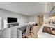 Well-lit living space with a comfortable sofa, modern TV setup, and a view of the kitchen area at 3722 Las Vegas Blvd # 1609, Las Vegas, NV 89158