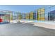 A rooftop pool with lounge chairs and city views through yellow tinted floor-to-ceiling windows at 3722 Las Vegas Blvd # 1609, Las Vegas, NV 89158