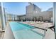 Beautiful rooftop pool area with lounge chairs, cabanas, and city views at 3722 Las Vegas Blvd # 1609, Las Vegas, NV 89158