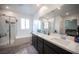 Bright bathroom featuring a double sink vanity, separate shower, and soaking tub at 3746 Bright Aquarius Ln, Henderson, NV 89052
