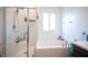 Bathroom showcases a tub-shower combination, and bright natural lighting at 3746 Bright Aquarius Ln, Henderson, NV 89052