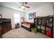 Bright bedroom with a ceiling fan, shelves, and a daybed with storage at 3746 Bright Aquarius Ln, Henderson, NV 89052