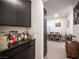 Dining room showcasing a bar area with ample storage that leads to a spacious eating area at 3746 Bright Aquarius Ln, Henderson, NV 89052