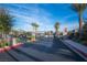 Community Entry Gate featuring a coded entry and wrought iron fencing at 3746 Bright Aquarius Ln, Henderson, NV 89052