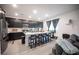 Stylish kitchen with a large island, dark cabinetry, and modern appliances at 3746 Bright Aquarius Ln, Henderson, NV 89052