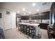 Open kitchen with a central island, stainless steel appliances, and dark cabinets at 3746 Bright Aquarius Ln, Henderson, NV 89052