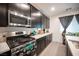 Modern kitchen with a stainless steel range and dark cabinetry at 3746 Bright Aquarius Ln, Henderson, NV 89052