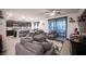 Spacious living room featuring plush seating and an open layout to the kitchen at 3746 Bright Aquarius Ln, Henderson, NV 89052