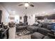 Open-concept living area with a cozy sectional sofa and a view of the kitchen at 3746 Bright Aquarius Ln, Henderson, NV 89052