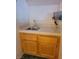 Convenient wet bar with tile countertop and wooden cabinets at 4135 Al Carrison St, Las Vegas, NV 89129