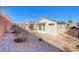 Backyard featuring low-maintenance landscaping and neighboring houses at 473 Elm Crest Pl, Henderson, NV 89012