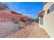 Expansive backyard with desert landscaping along the side of the home at 473 Elm Crest Pl, Henderson, NV 89012