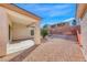Charming backyard featuring low-maintenance landscape and covered patio at 473 Elm Crest Pl, Henderson, NV 89012
