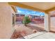 Inviting backyard with low-maintenance landscaping and a covered patio at 473 Elm Crest Pl, Henderson, NV 89012