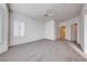Primary bedroom features neutral carpet, and two doors for access to other parts of the home at 473 Elm Crest Pl, Henderson, NV 89012