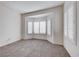 This bedroom features neutral carpet, bay window with shutters, and white walls at 473 Elm Crest Pl, Henderson, NV 89012