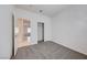 Bright bedroom with carpet and a glimpse into the tiled hallway at 473 Elm Crest Pl, Henderson, NV 89012
