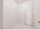 Clean entryway with tile flooring and a white front door at 473 Elm Crest Pl, Henderson, NV 89012