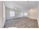 Spacious carpeted living room with natural light and a ceiling fan at 473 Elm Crest Pl, Henderson, NV 89012