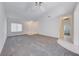Expansive living room featuring neutral carpet, white walls, and ample space at 473 Elm Crest Pl, Henderson, NV 89012