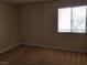 Neutral bedroom featuring a window with closed blinds and carpet flooring at 4965 Indian River Dr # 108, Las Vegas, NV 89103
