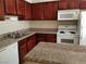 Kitchen features stainless steel appliances, dark wood cabinetry, and light countertops at 4965 Indian River Dr # 108, Las Vegas, NV 89103