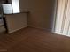 Living room featuring carpet flooring and open access to the kitchen at 4965 Indian River Dr # 108, Las Vegas, NV 89103