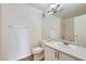 Bathroom featuring a single sink vanity, large mirror, tub shower and tile floors at 5000 Red Rock St # 105, Las Vegas, NV 89118