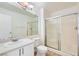 Bright bathroom features a single sink vanity, mirror, toilet and enclosed shower at 5000 Red Rock St # 105, Las Vegas, NV 89118