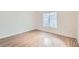 Clean and bright bedroom with wood-look floors and a window that lets in plenty of light at 5000 Red Rock St # 105, Las Vegas, NV 89118